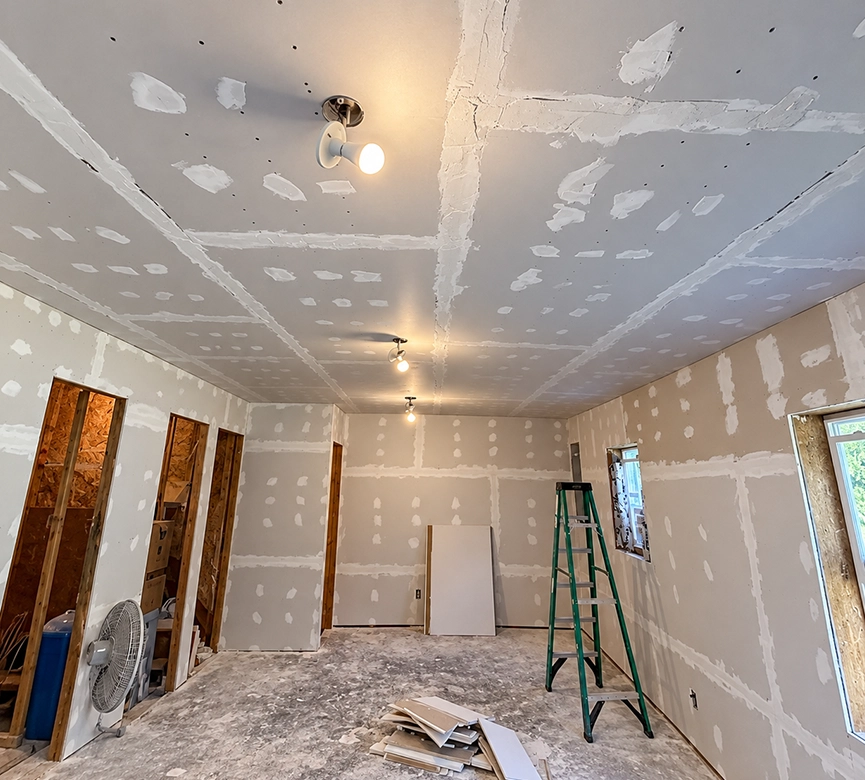 Room Undergoing Drywall Installation with Ladder for Bathroom Remodeling