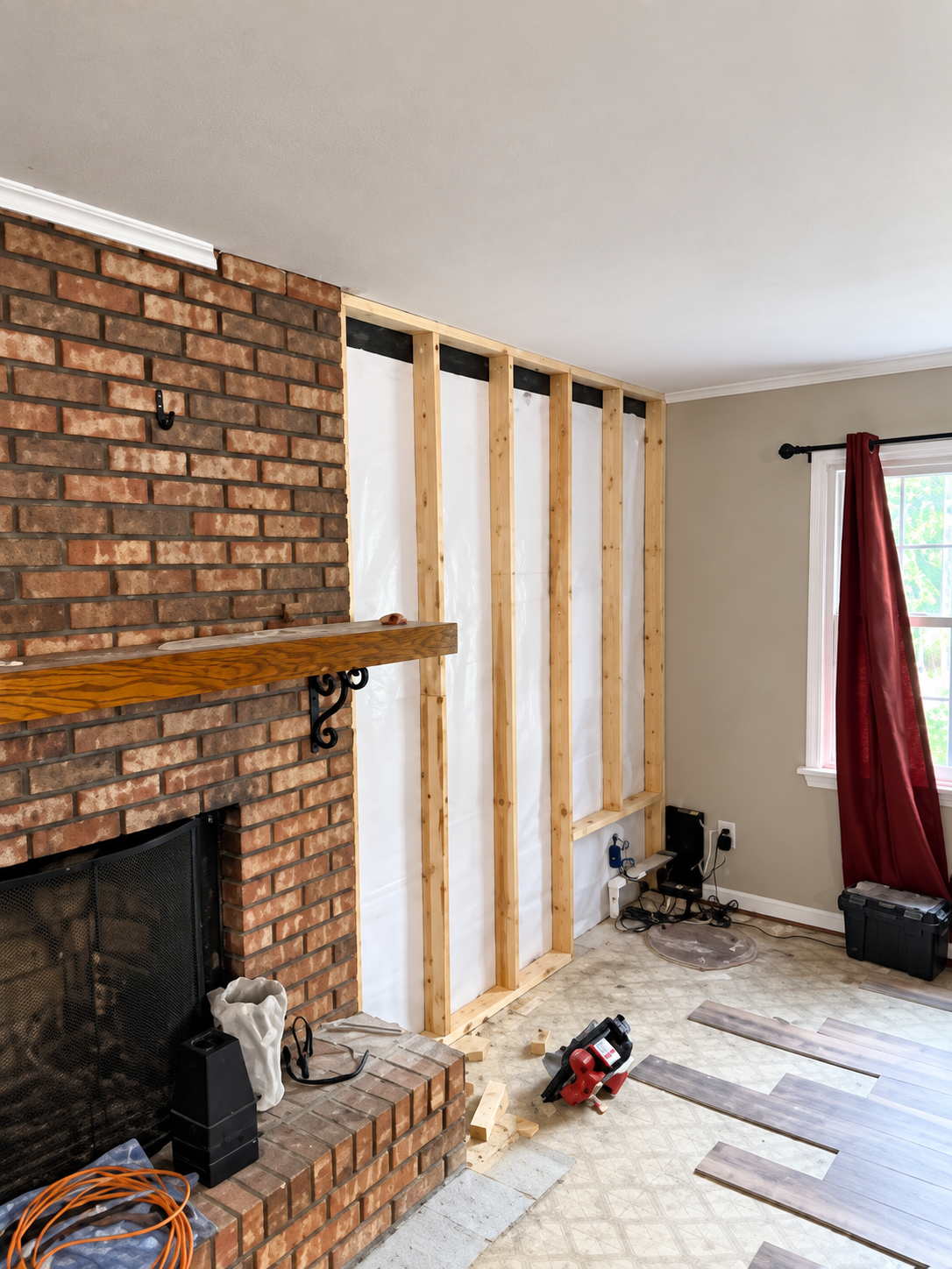 Living Room Under Construction with Exposed Wall and Tools for Remodeling