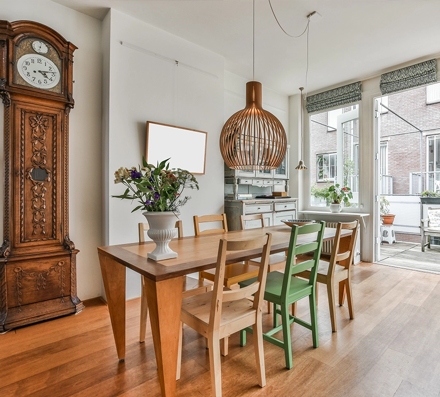 Bright Dining Room with Wooden Furniture and Tall Antique Clock